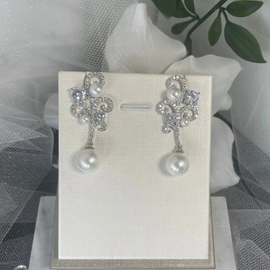Ariana Crystal Pearl Earrings: Wave-Inspired Elegance for Special Occasions.