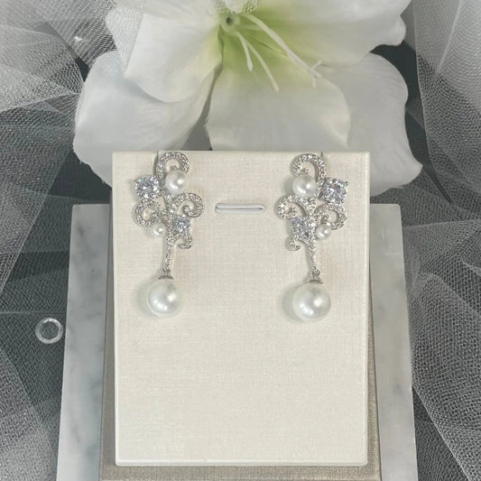 Ariana Crystal Pearl Earrings: Wave-Inspired Elegance for Special Occasions.