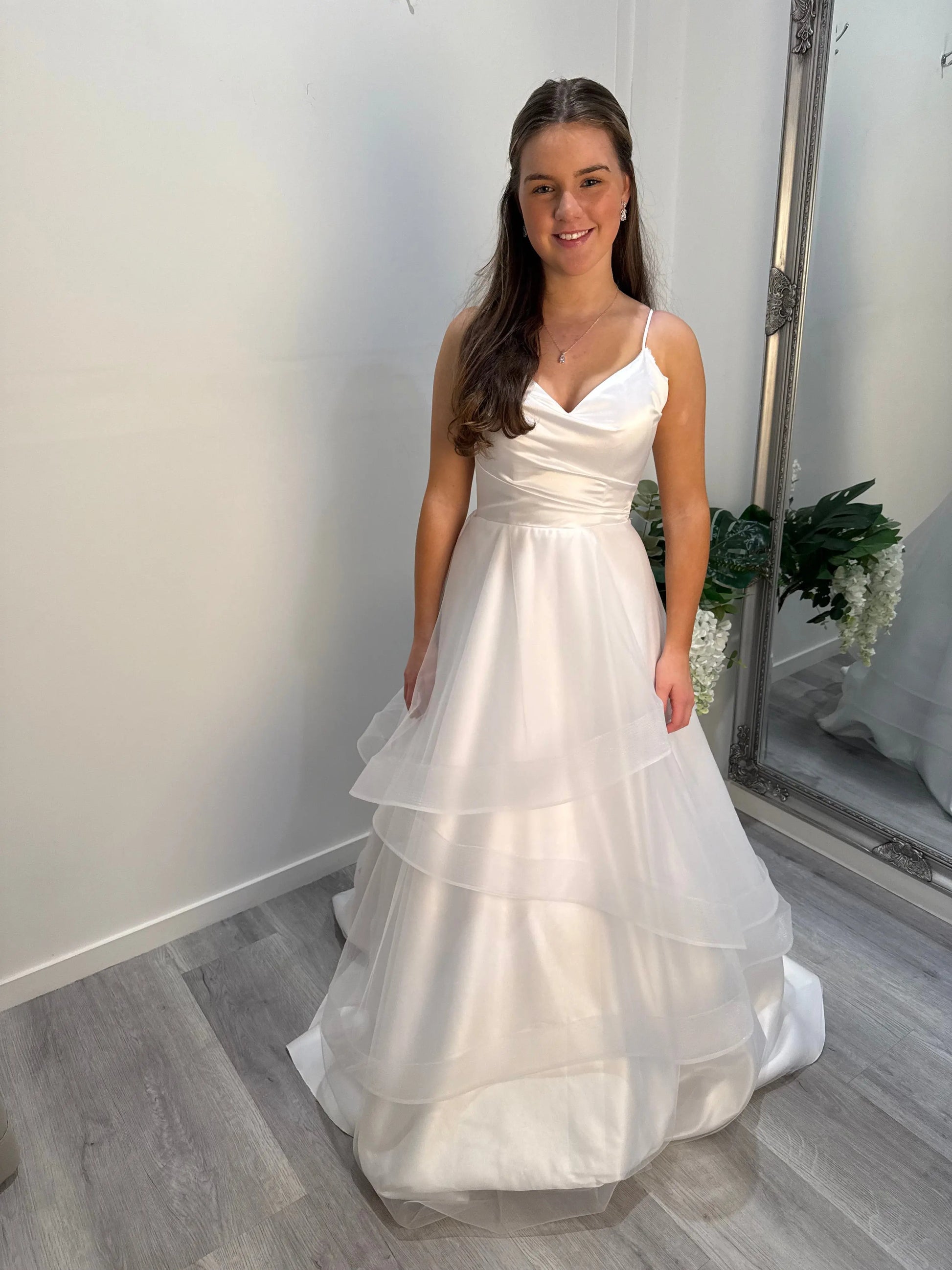 Front view of the Chloe Deb Dress with model facing camera, showcasing elegant fit