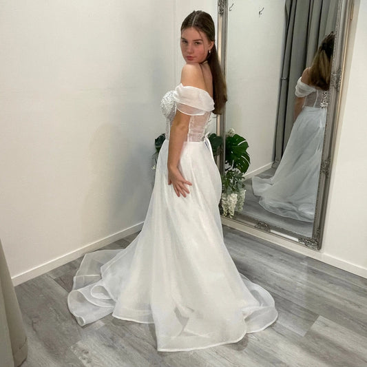 Front view of Diana Debutante Dress featuring a sculpted corset-style bodice with bead detailing and a scoop neckline, paired with supportive straps and an elegant A-line organza skirt.