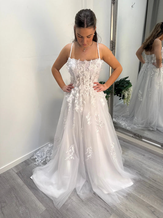 Front of the Judy debutante dress, model looking down showcasing neckline