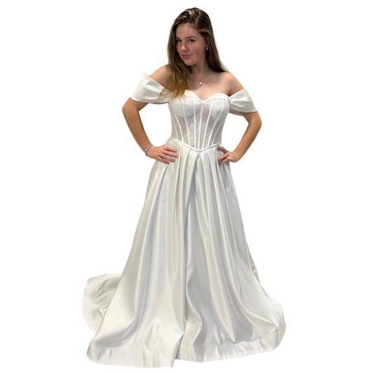 Front view of Vallorie Debutante Dress showcasing a sweetheart neckline, lace corset bodice with beaded detailing, and a satin A-line skirt with pleated waist.