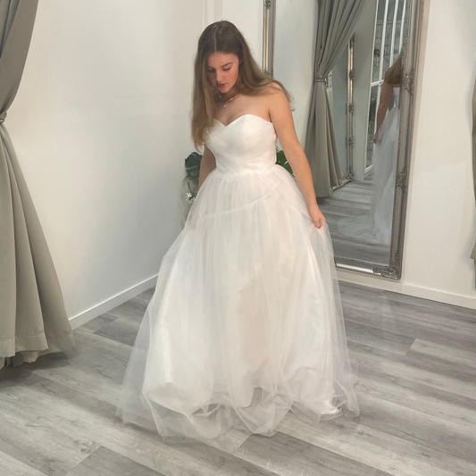 Elegant front view of Velora Debutante Dress featuring a lace corset bodice, sweetheart neckline, and a soft satin A-line skirt with pleats, creating a graceful silhouette.