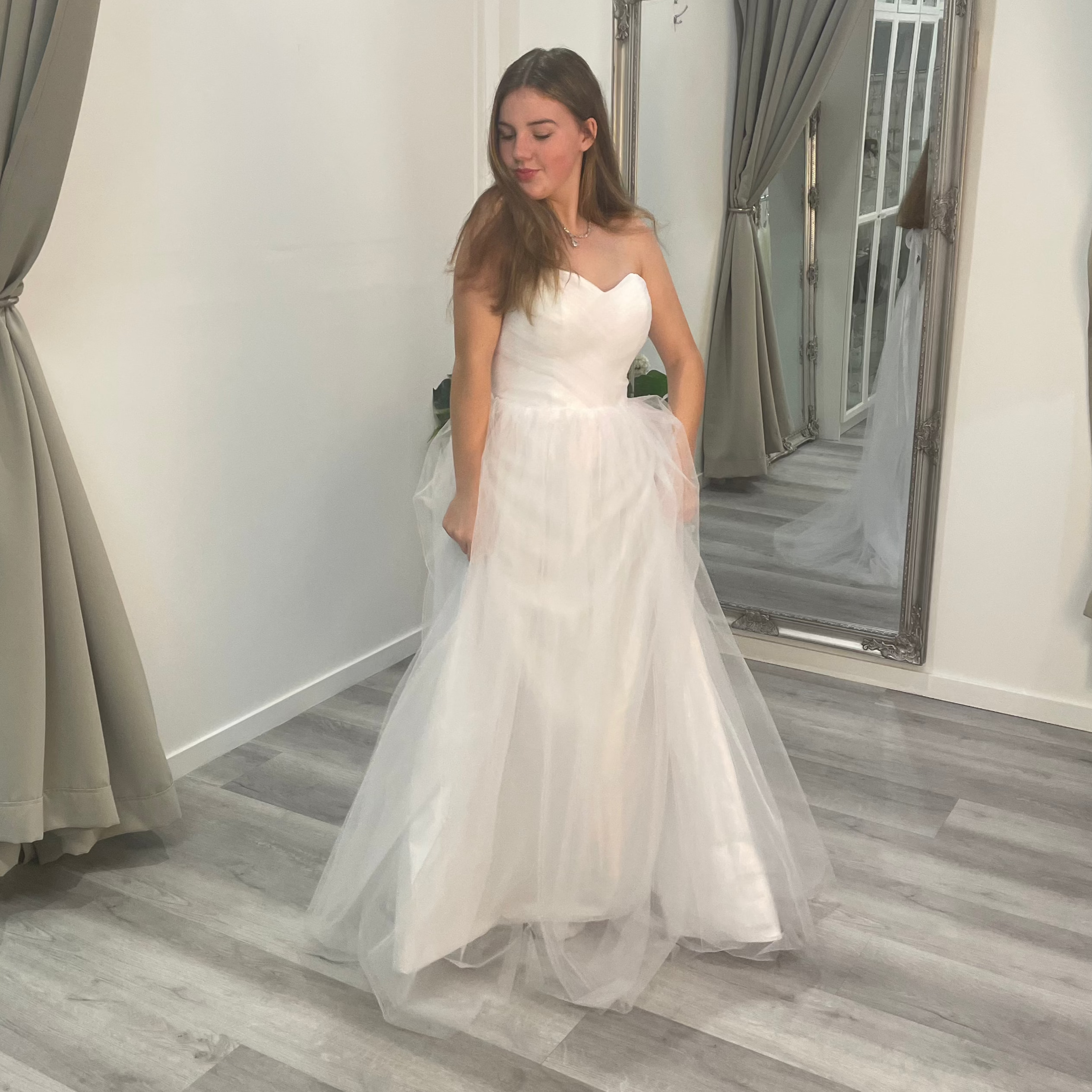 Stunning front view of Velora Debutante Dress with a lace corset bodice, delicate straps, and a flowing satin A-line skirt with pleats at the waist, perfect for formal occasions.