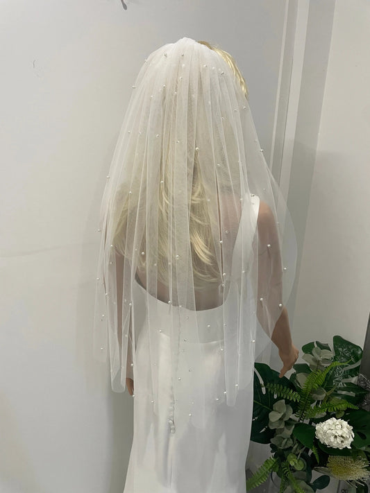 Back view of bride wearing 75cm pearl bridal veil in soft tulle