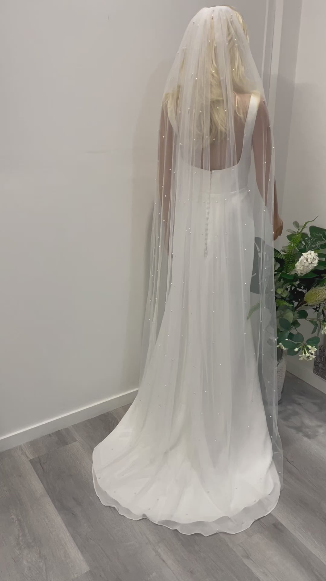 Cathedral-length pearl veil in motion – 2m veil with hand-placed pearls and soft tulle
