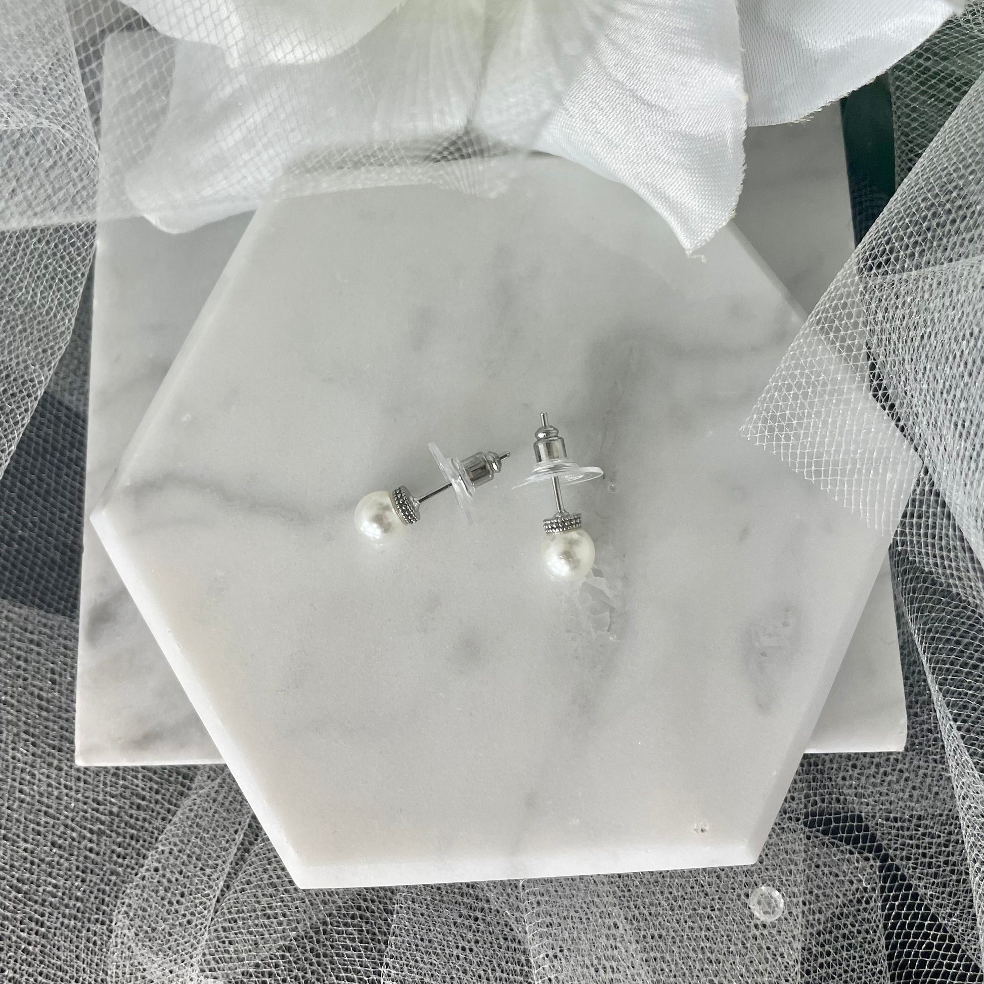 Kelsey Bridal Pearl Stud Earrings - Elegant bridal earrings with silver detailing.