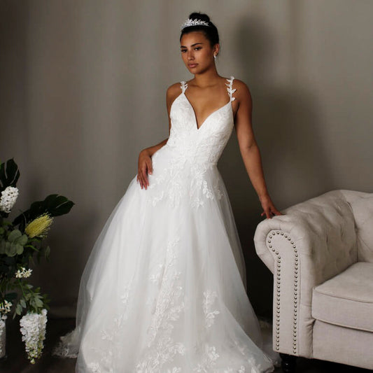 Holly Lace A-line Bridal Gown with Deep V-neckline by Divine Bridal.