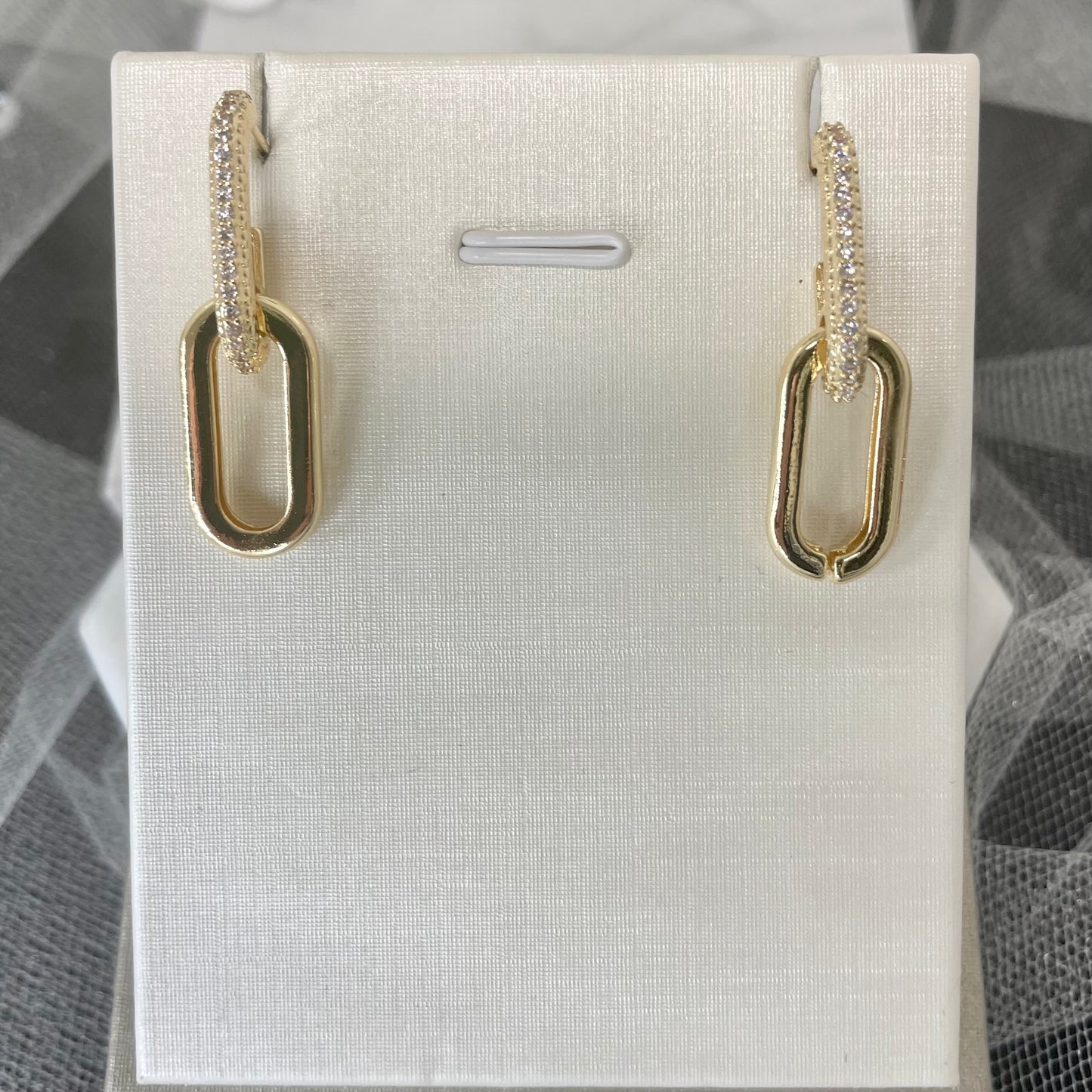 "Brenda Gold Earrings featuring two exquisite oval shapes, showcasing timeless elegance and sophistication."