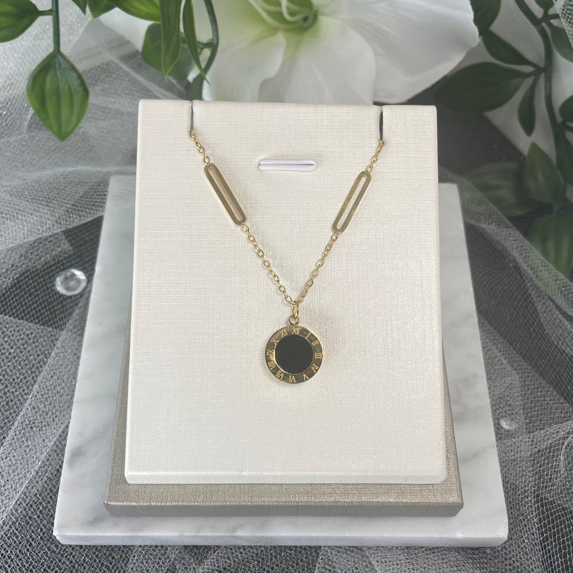Adorn bridal necklace with reversible black & white Roman digital wafer pendant, gold accents, and stainless steel chain.