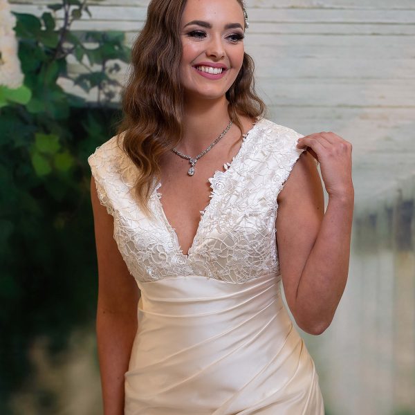 Hillary Gown by Divine Bridal - V-neck silk wedding dress with lace bodice and chapel train.