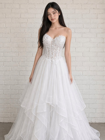 Abby V1 white sheer corset debutante dress, front view on mannequin with floral lace bodice and full ruffle skirt