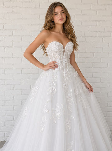 Alana V1 white 3D floral debutante dress, front view on model with raised flower corset and cascading lace tulle skirt
