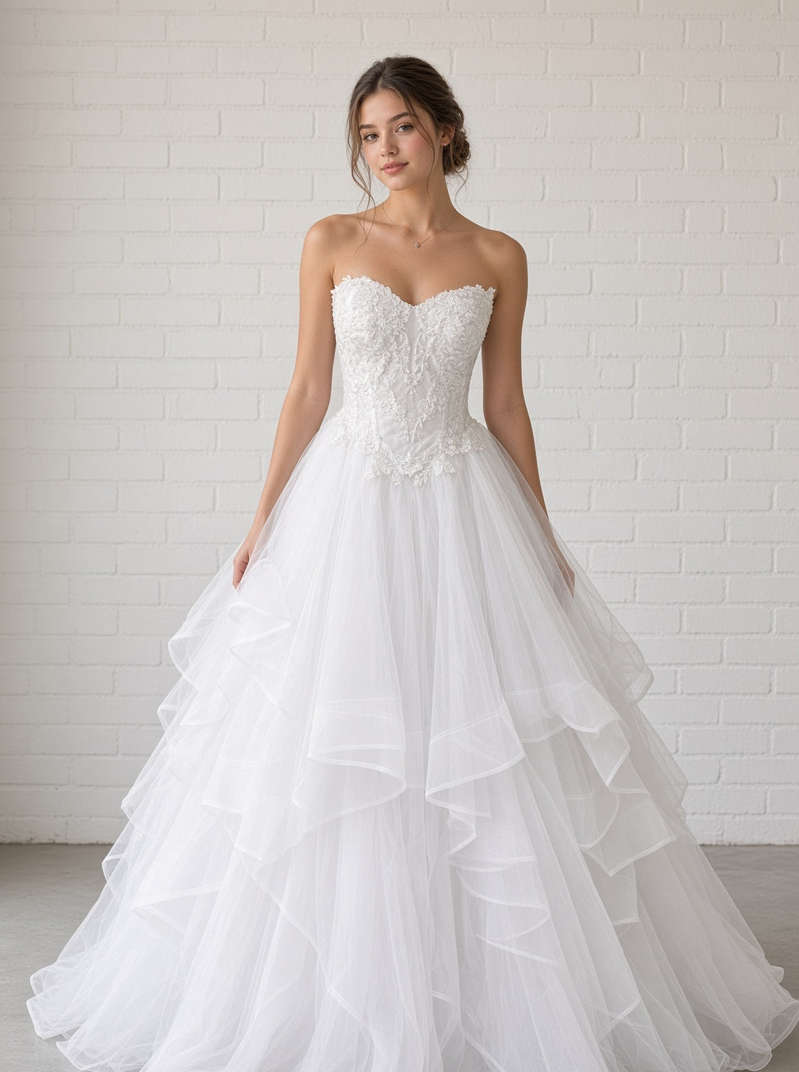 Amaira V1 white floral appliqué debutante dress, front view on model with strapless lace corset and full ruffle skirt