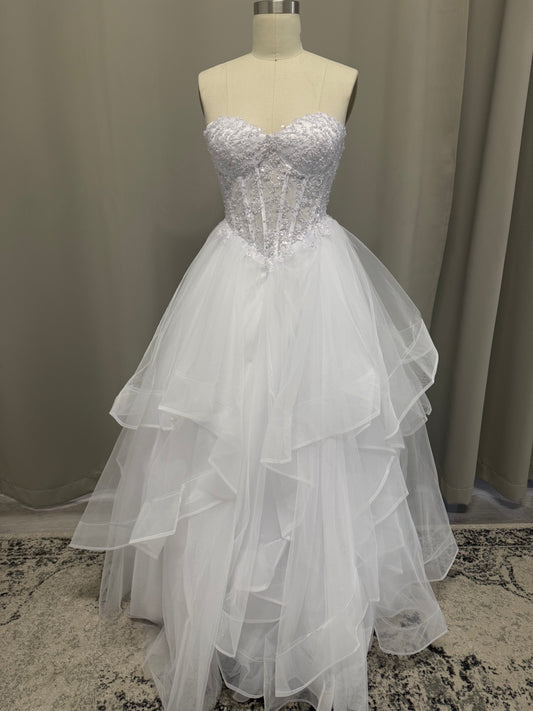 Anvi V1 white beaded debutante dress, front view on mannequin with lace corset and full ruffle skirt