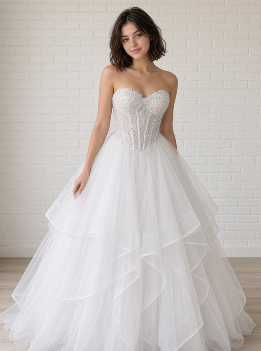 Anvi V1 white beaded debutante dress, front view on model with lace corset and full ruffle skirt