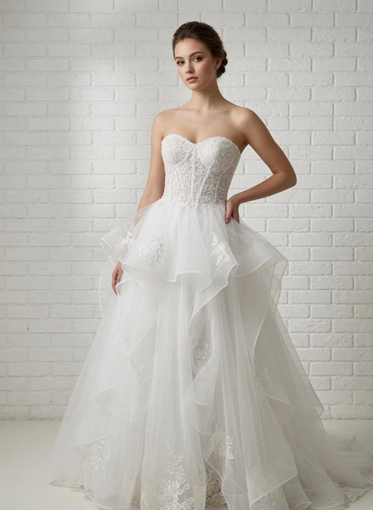 April Floral Lace Ruffled Strapless Debutante Ball Gown front view - elegant white lace corset and flowing ruffled tulle skirt