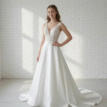 Elegant white V-neck sleeveless satin debutante dress with intricate lace bodice and flowing A-line skirt with train.