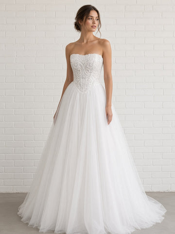 Ava V1 white scroll lace debutante dress, front view on model with beaded corset and full tulle skirt