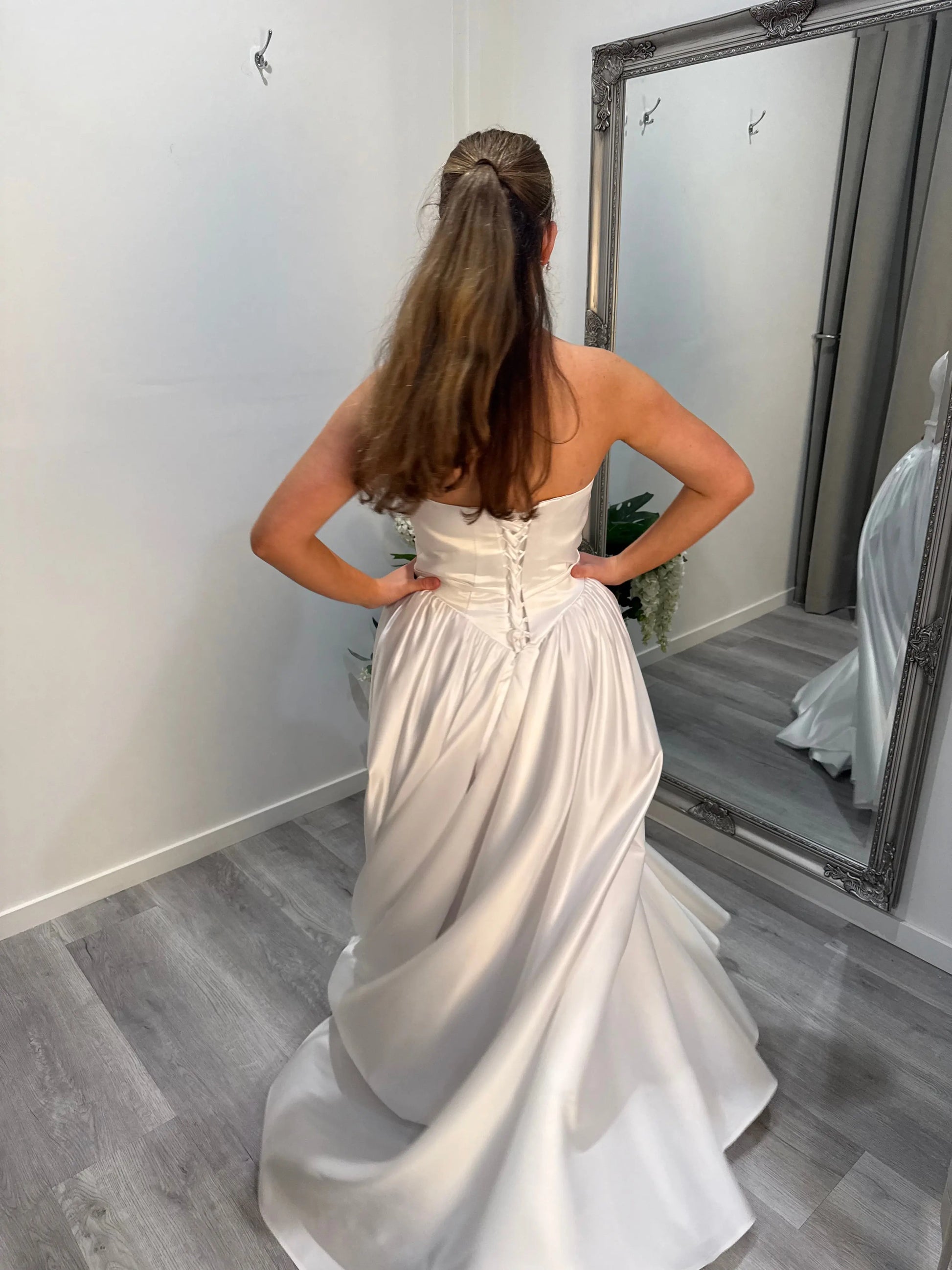 Back of Billie debutante dress, skirt slightly twisted