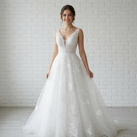 Elegant white V-neck sleeveless debutante dress with intricate floral lace appliqués on the bodice and full flowing tulle skirt.