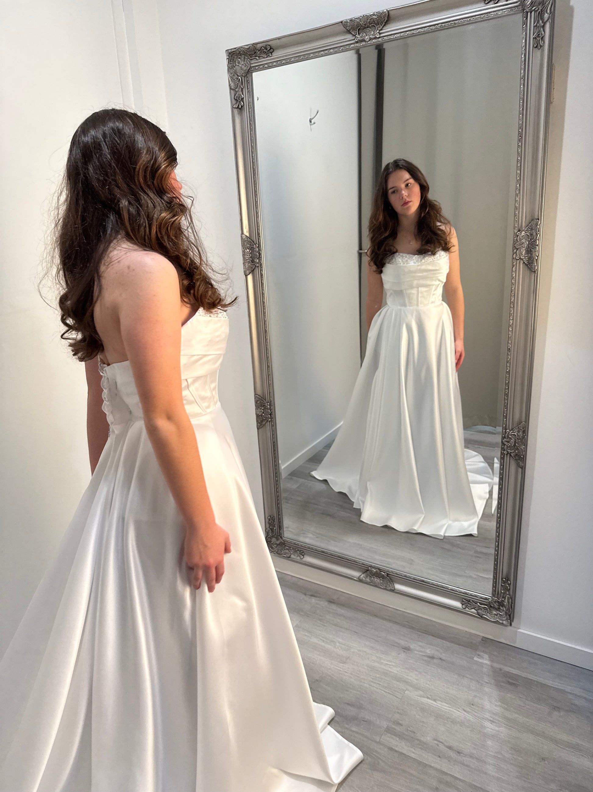 Back view of Celestia Debutante Dress showcasing flattering silhouette and layered tulle skirt – Divine Bridal.