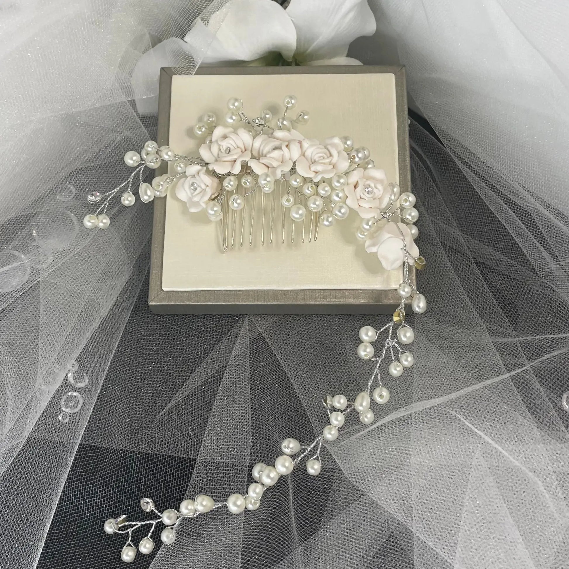 Clara Hair Vine by Divine Bridal: Elegant Flower Arrangement with Pearl Design.