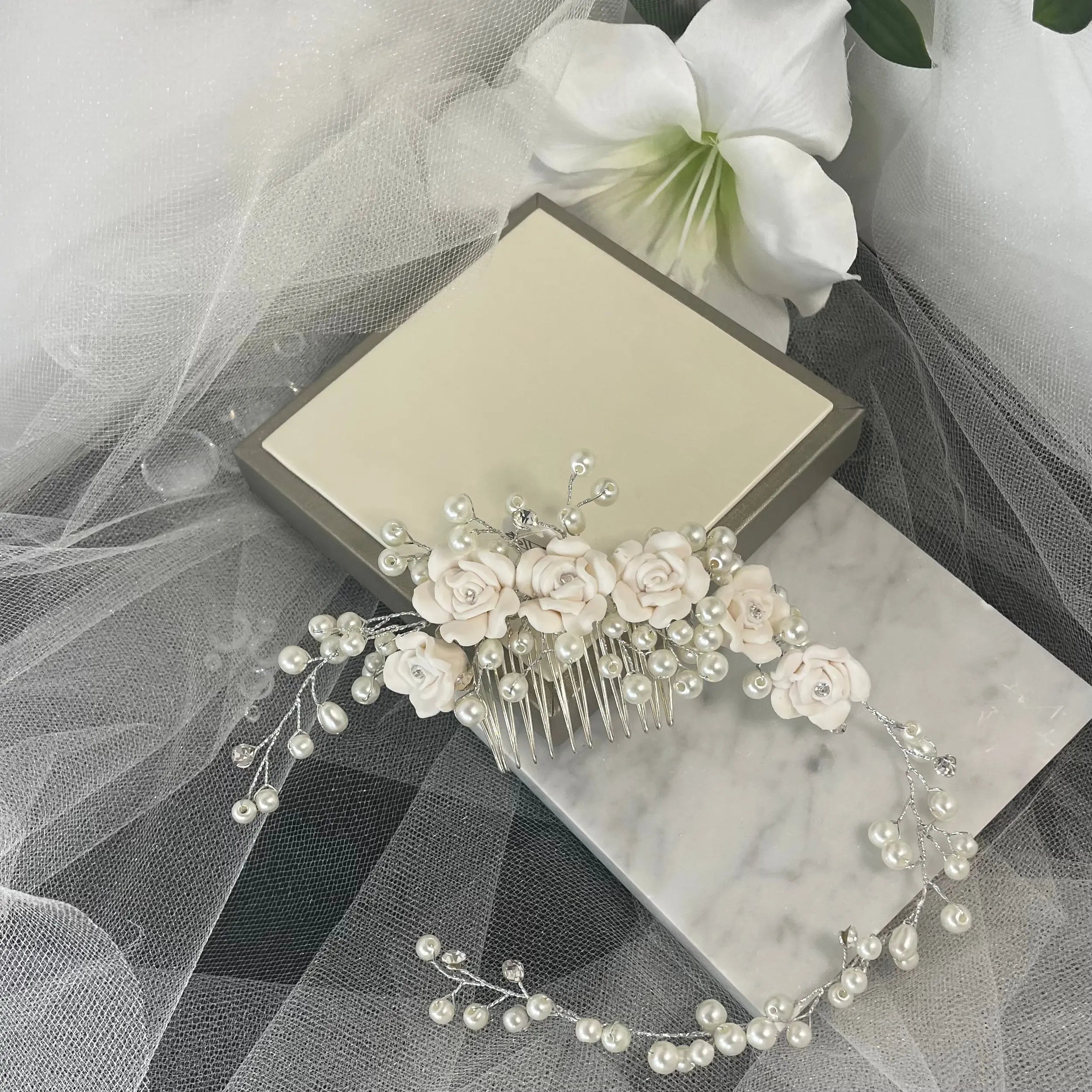 Clara Hair Vine by Divine Bridal: Elegant Flower Arrangement with Pearl Design.