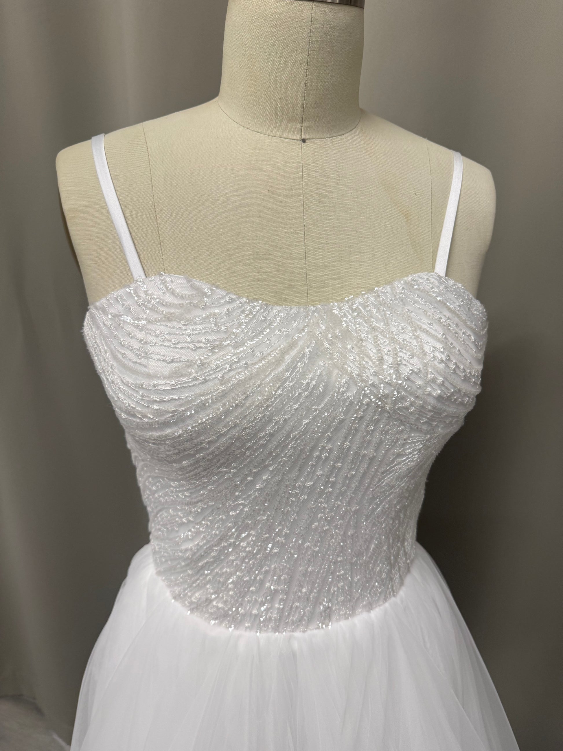Close-up of Luna Beaded Strapless Debutante Gown bodice showing intricate sparkling beadwork