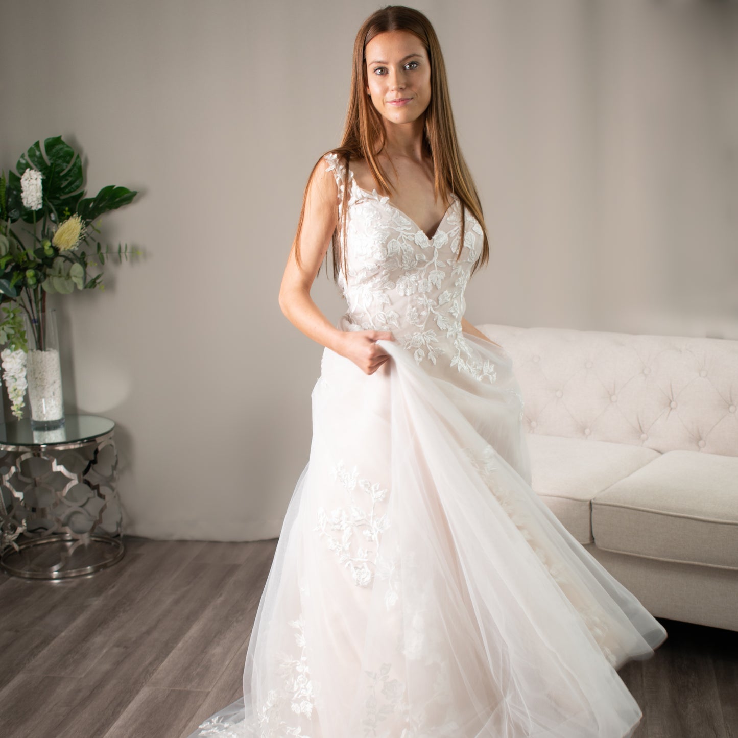 Paulette Lace Wedding Dress displayed in a beautiful setting