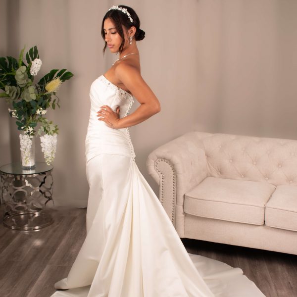 Bride in Colette's Sweetheart Mermaid Wedding Dress with intricate beading and elegant satin draping