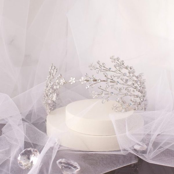 Stunning Larisa Bridal Headband, lavishly adorned with sparkling CZ crystals in a classic silver setting, designed to add radiant elegance to any bridal hairstyle.