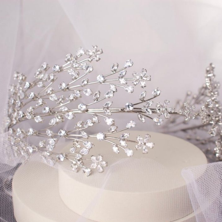 Stunning Larisa Bridal Headband, lavishly adorned with sparkling CZ crystals in a classic silver setting, designed to add radiant elegance to any bridal hairstyle.