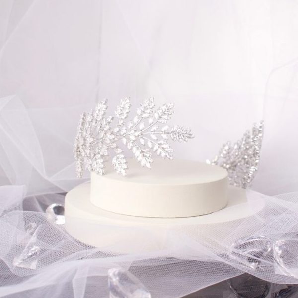 Stunning Mayla Bridal Tiara featuring dazzling marquise solitaire crystals set in a leaf and flower asymmetric pattern, crafted in elegant silver to enhance any bridal look.