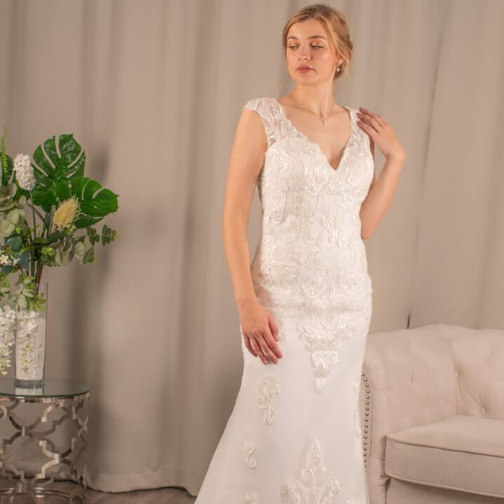 Caroline V-Neck Lace Mermaid Wedding Gown by Divine Bridal.