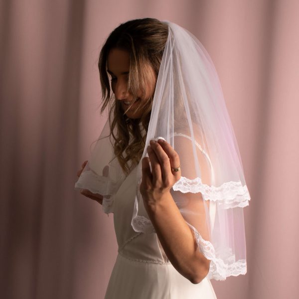 Paula Lace Trim Veil with intricate lace detailing on American tulle, creating a unique and elegant bridal accessory.