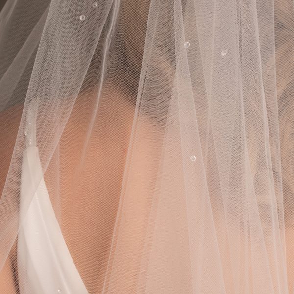 Close-up of the Ebony Scattered Swarovski Crystal Bridal Veil, highlighting the Swarovski crystals on  US tulle.
