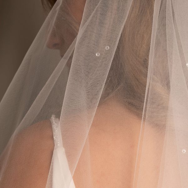 Close-up of the Ebony Scattered Swarovski Crystal Bridal Veil, highlighting the Swarovski crystals on US tulle.