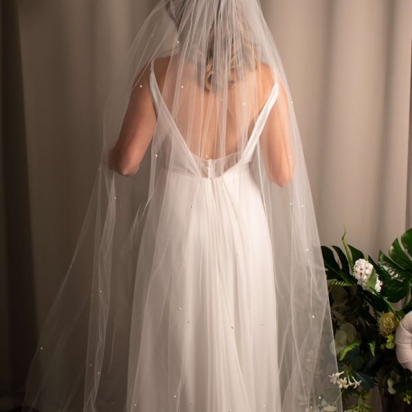 Bride adorned in Jacinta Pearl Cathedral Wedding Veil, highlighting the 3-meter length and flowing elegance.