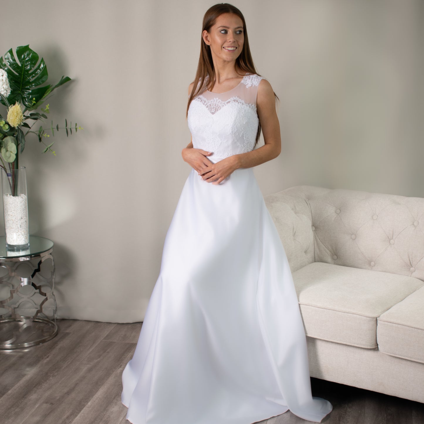 Matilda Debutante Dress by Divine Bridal with lace bodice, illusion and sweetheart neckline, satin skirt, and satin waist ribbon.
