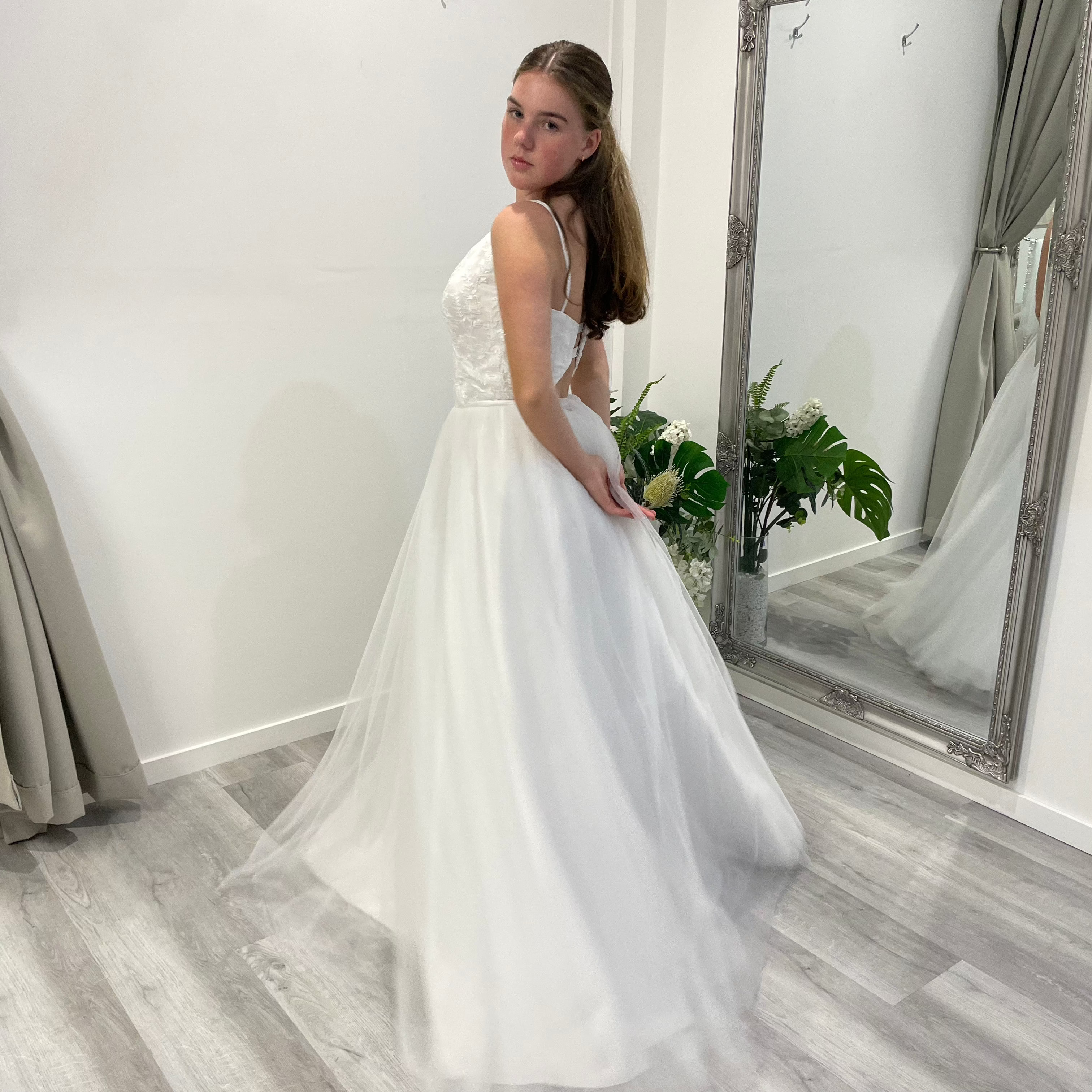 Valentina Lace Essence deb dress with V-neckline, lace bodice, spigot straps, and customizable skirt options