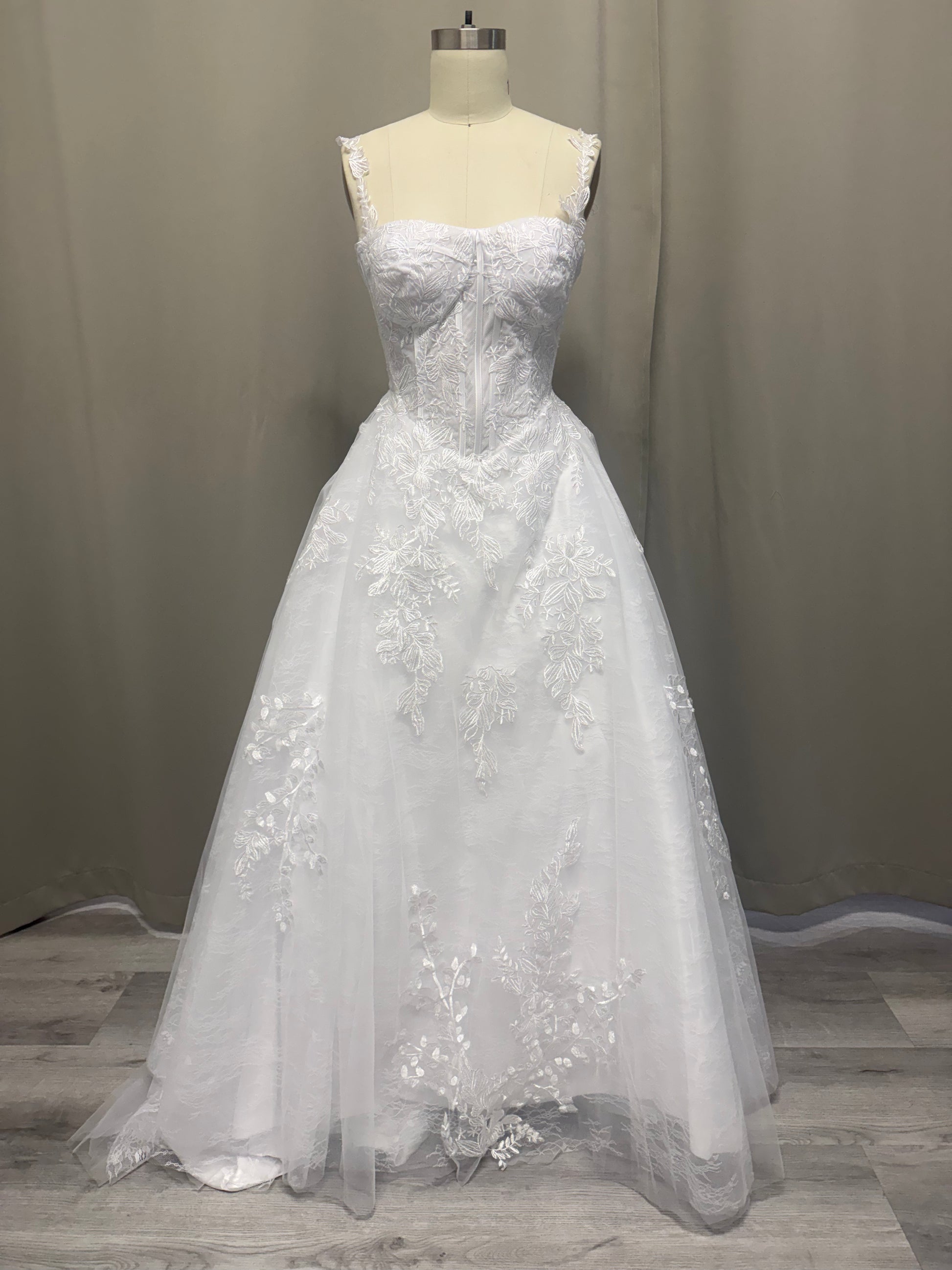 Deborah V1 white lace appliqué deb ball dress, front view on mannequin, sweetheart corset bodice, lace straps and full tulle skirt
