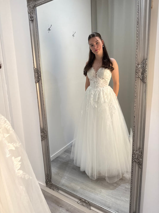 Romantic white Dua Wedding Dress with embroidered lace bodice and full tulle A-line skirt.