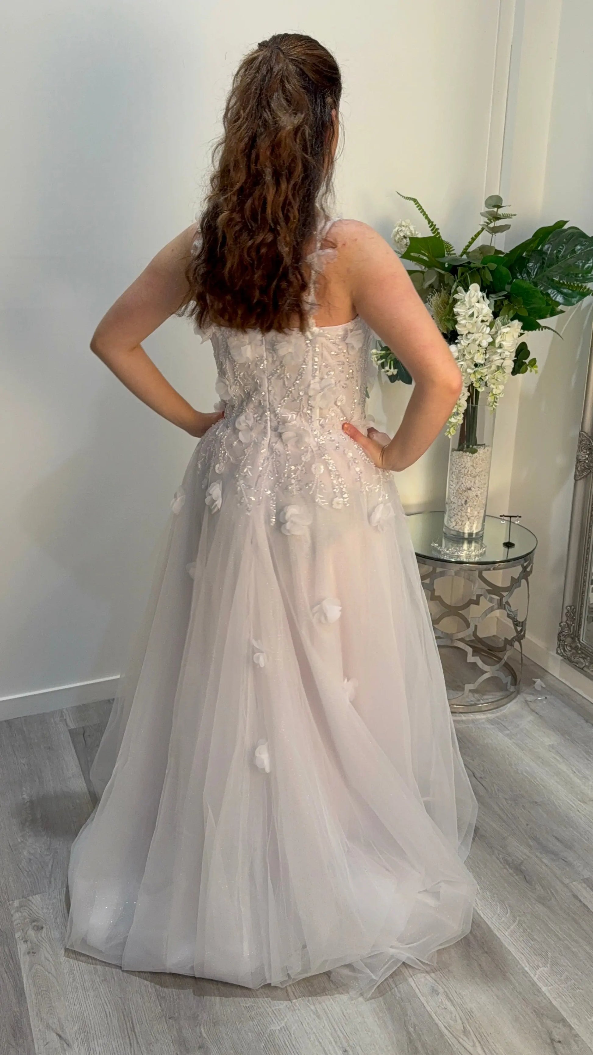 Woman showing off the back of the dress