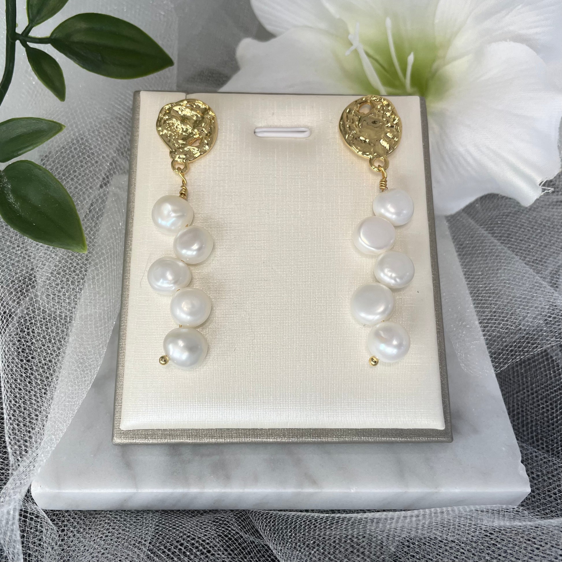Close-up of Debora Baroque Pearl Earrings, showcasing their natural, trendy design - Divine Bridal