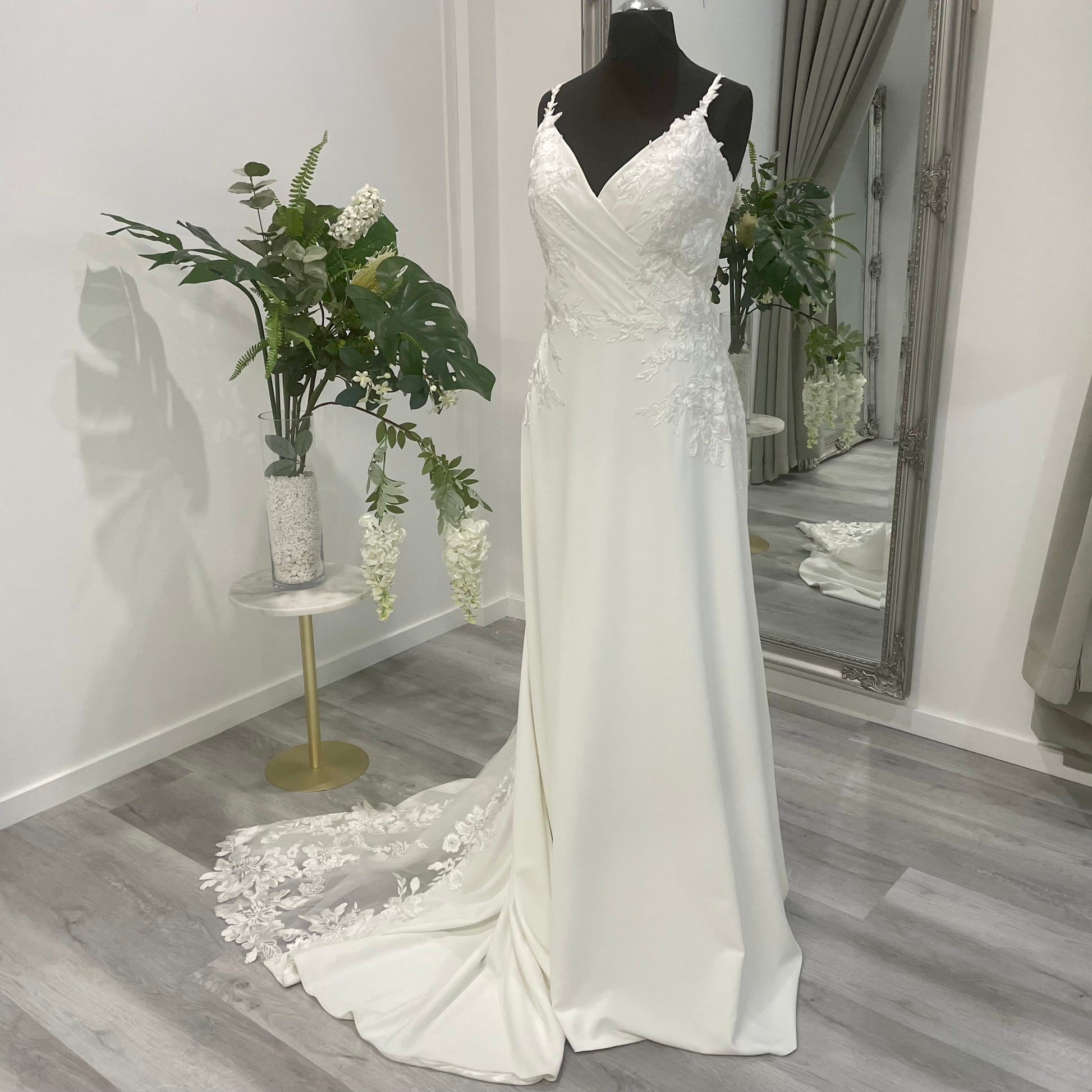 Harlow Wedding Dress with lace detailing and V-neckline on display at Divine Bridal salon.