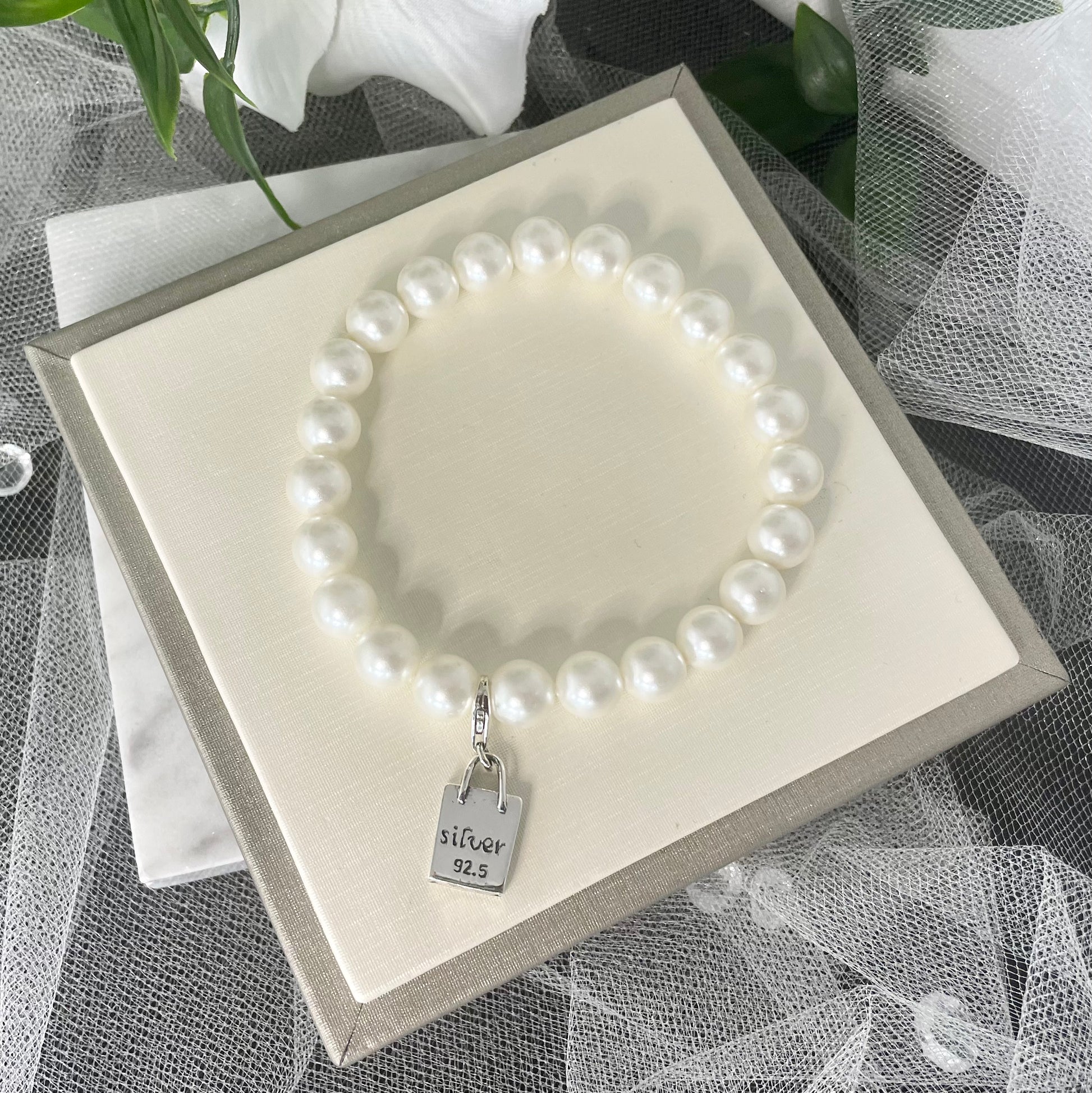 Elegant Isla Pearl Bracelet with 92.5% sterling silver design and elastic fit.