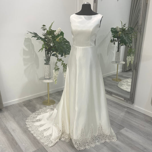 Front view of Jenny Bridal Dress with delicate lace train at Divine Bridal.