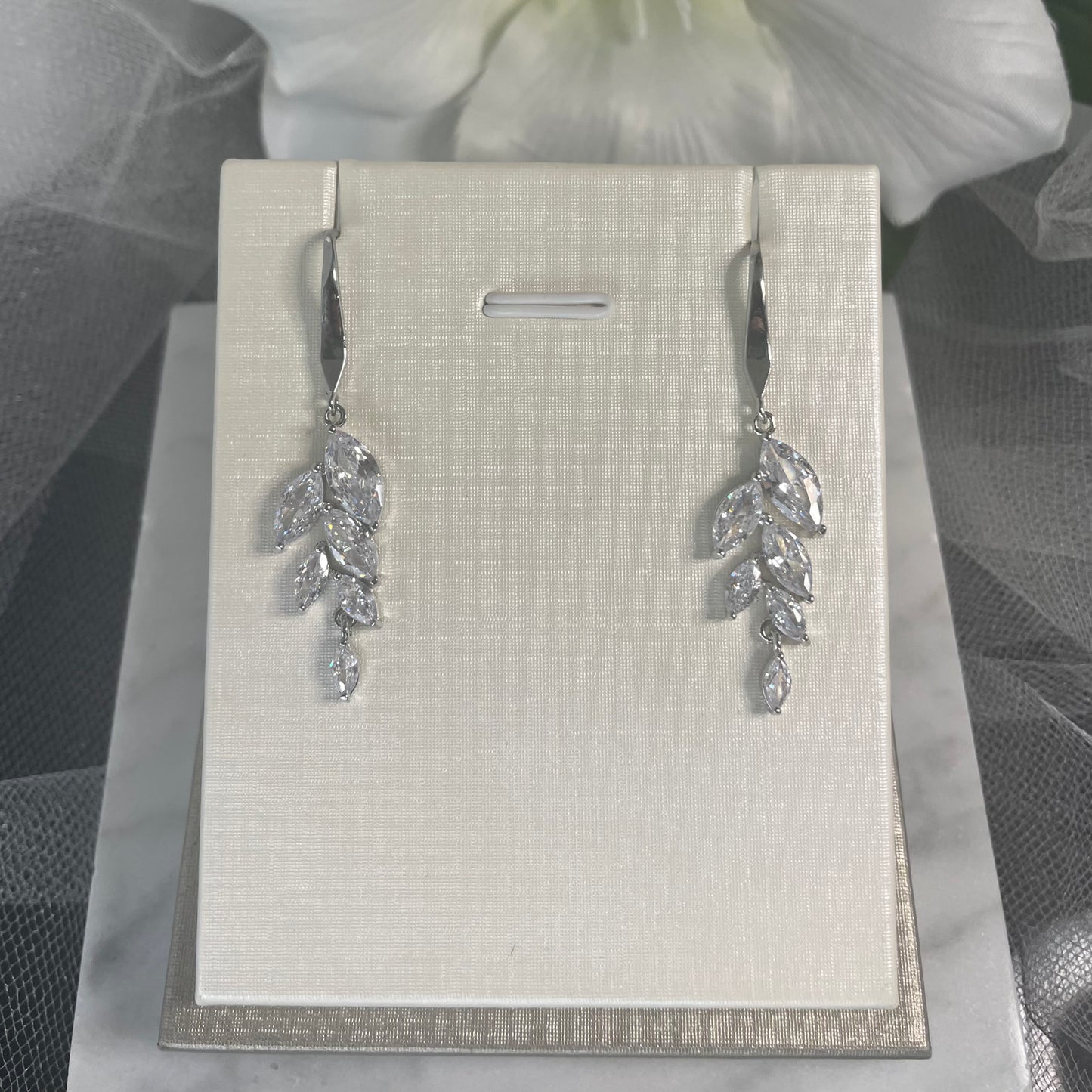 Damara Waterdrop Cubic Zirconia Silver Bridal Earrings with a Leaf Design - Divine Bridal