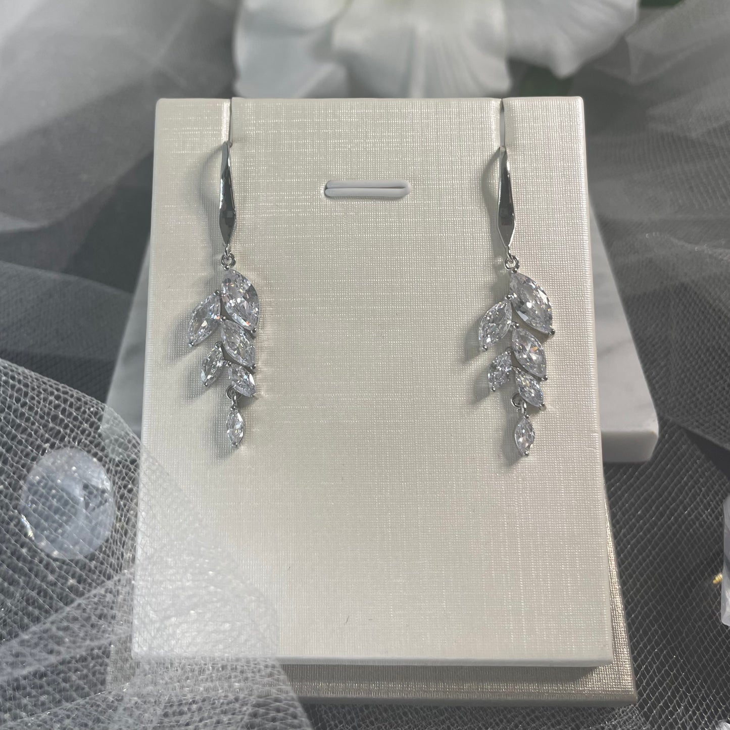 Damara Waterdrop Cubic Zirconia Silver Bridal Earrings with a Leaf Design - Divine Bridal